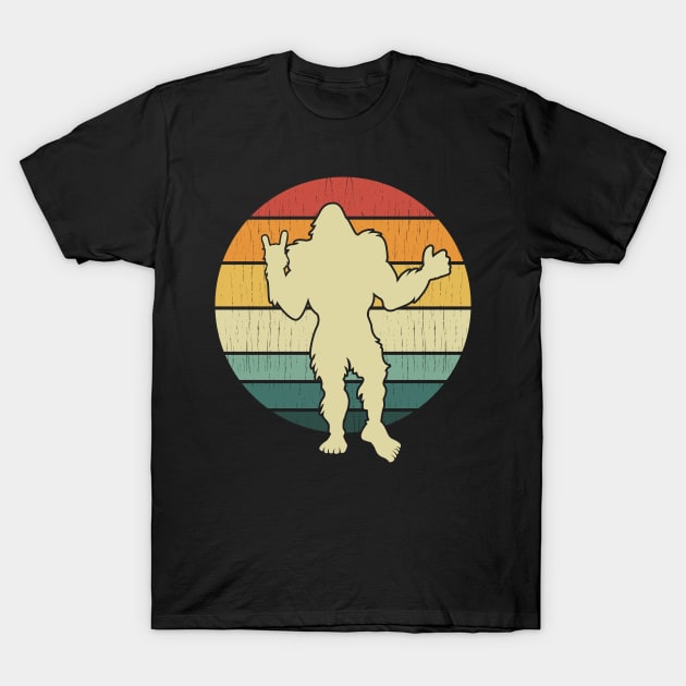 Bigfoot Holding Up Rock On Fist T-Shirt by Tesszero